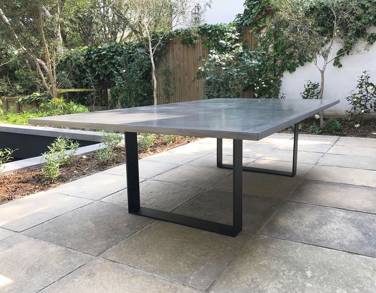 Atlas architectural GFRC concrete dining table by KATACHI Studio.