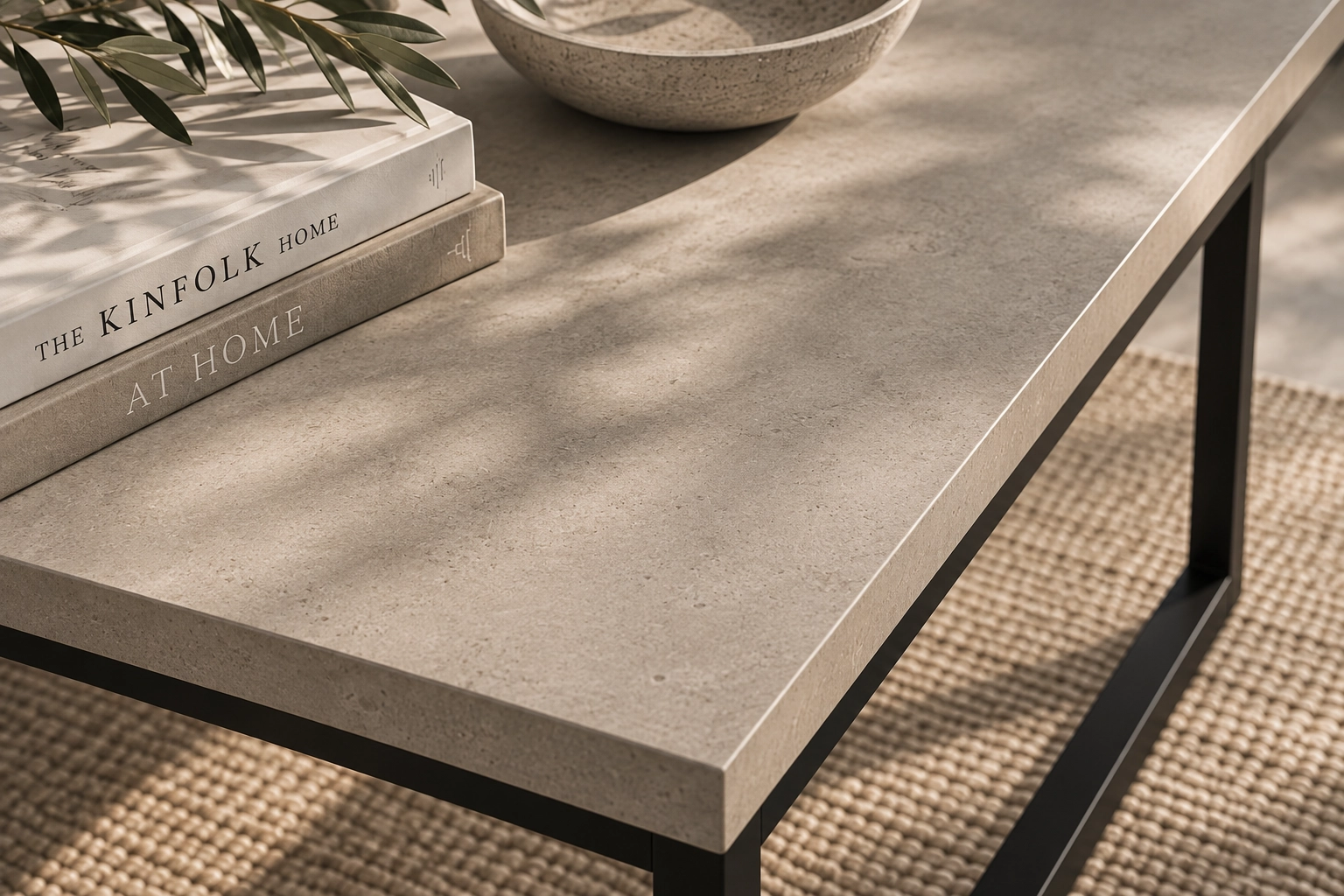 Close-up of the smooth mineral-toned GFRC surface of the KATACHI coffee table