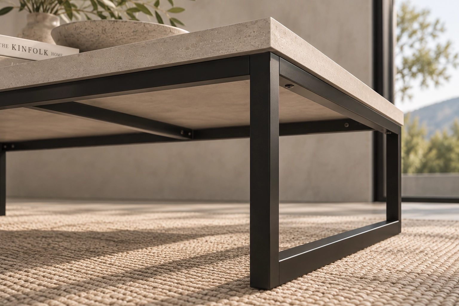 Detailed view of the matte-black steel frame beneath the KATACHI coffee table