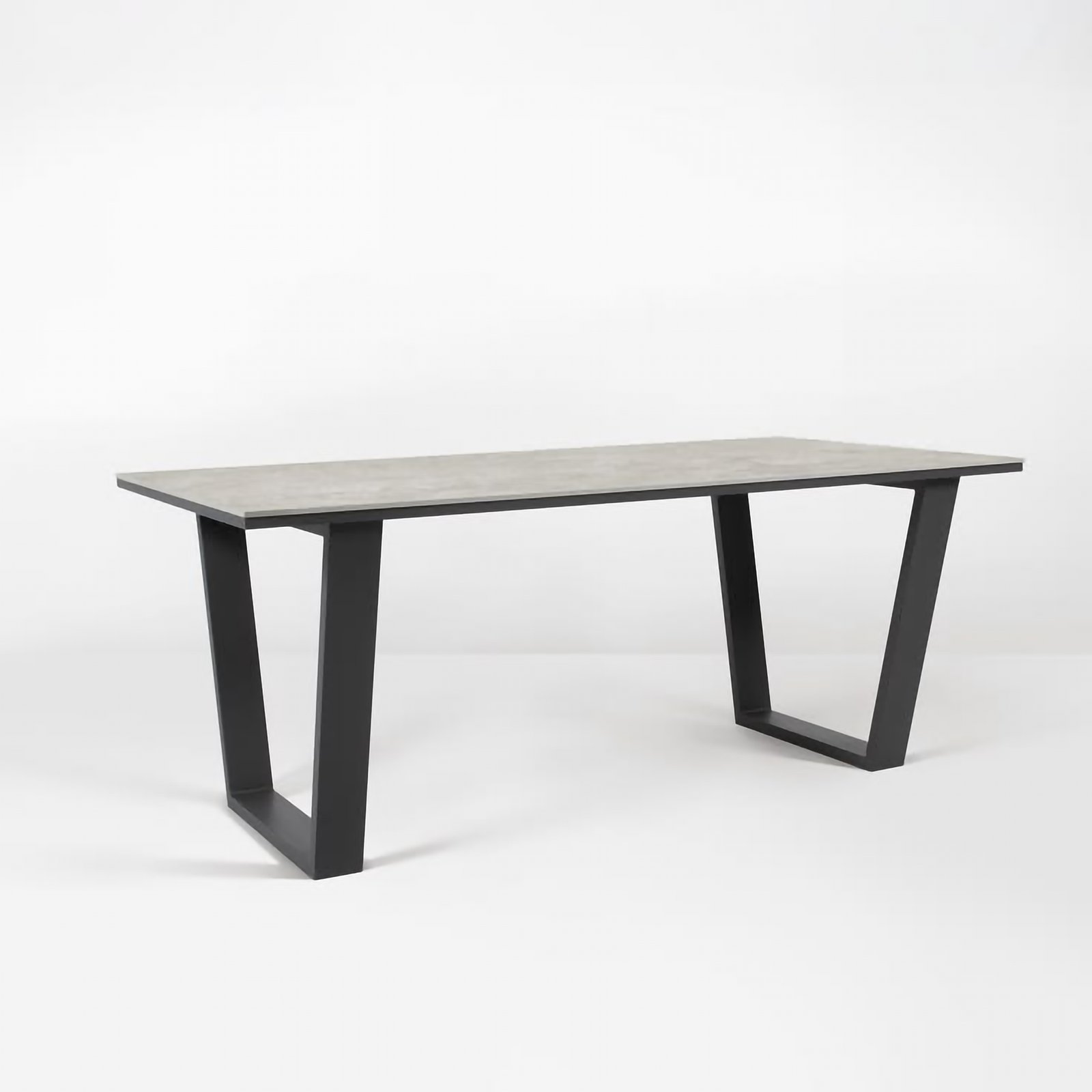 KATACHI dining table with mineral GFRC top and black steel frame