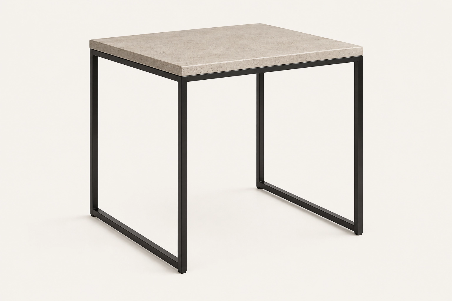 KATACHI Side Table with thin mineral-toned GFRC top and slender matte-black steel frame on a warm off-white background